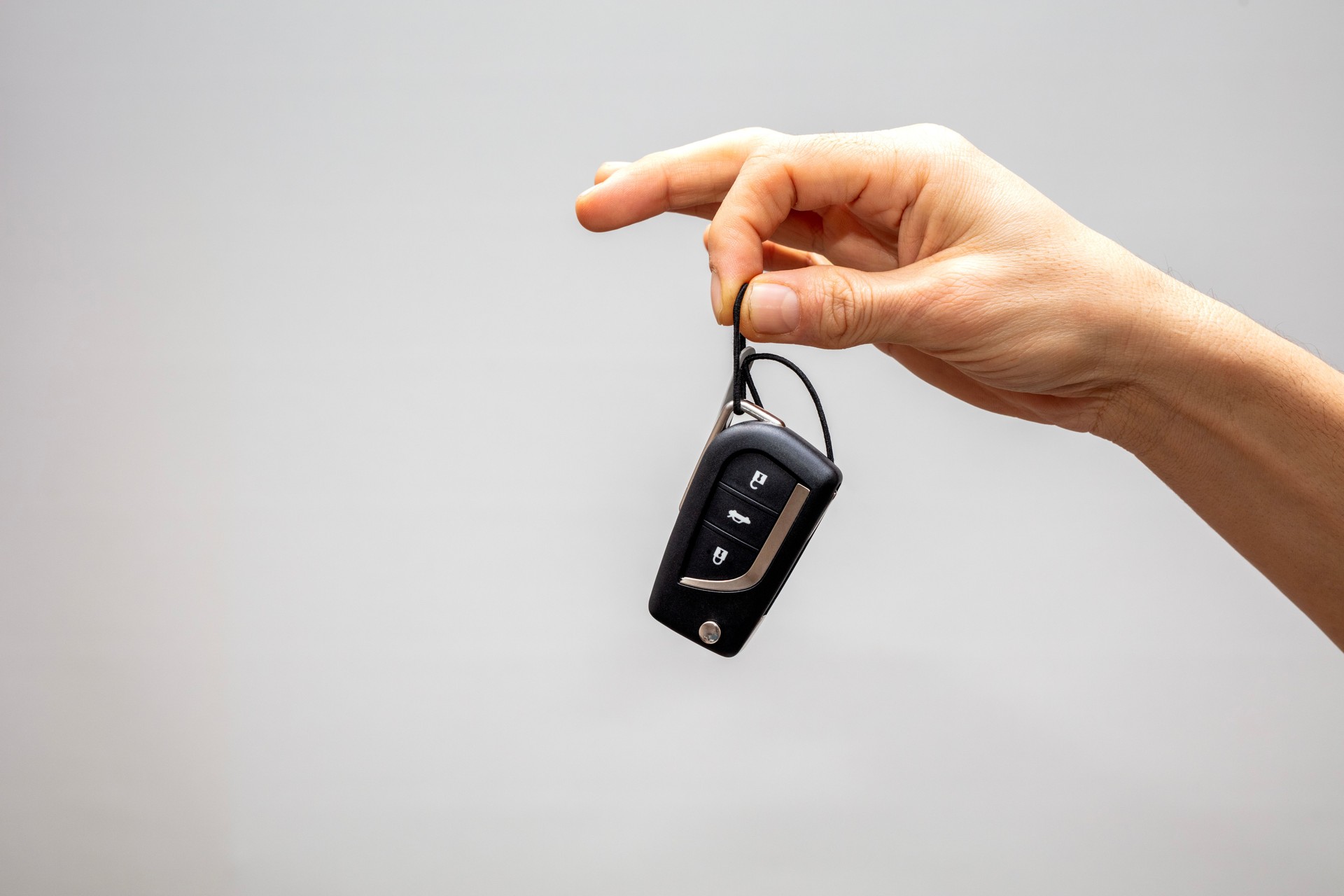 Man hand holding car key